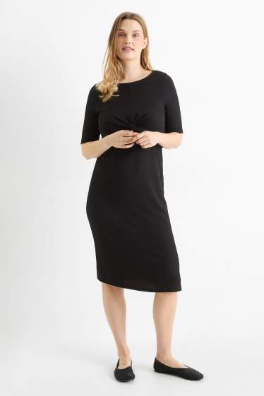 Femmes - Robe de grossesse - finition texturée - noir