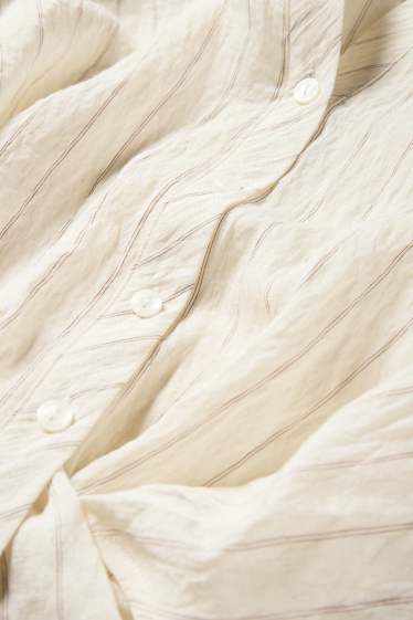 Dames - Blouse met knoop in de stof - gestreept - crème wit