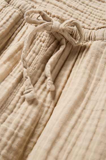 Dona - Pantalons de tela - mid waist - loose fit - beix