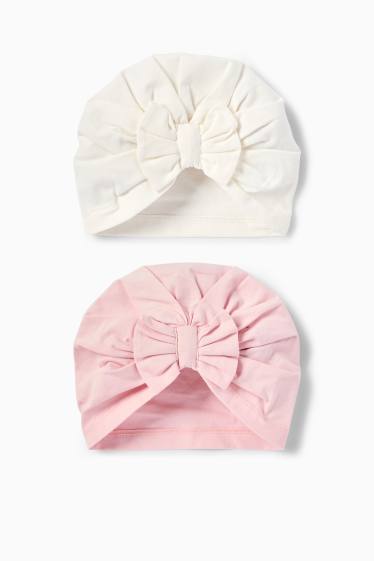 Bebeluși - fete - Multipack 2 buc. - căciulă tip turban - alb / roz