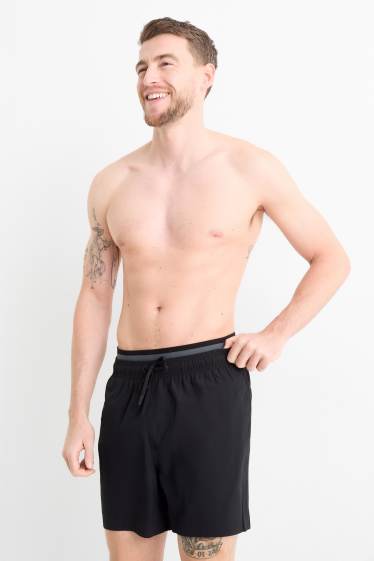 Hommes - Short de bain - look 2-en-1 - noir