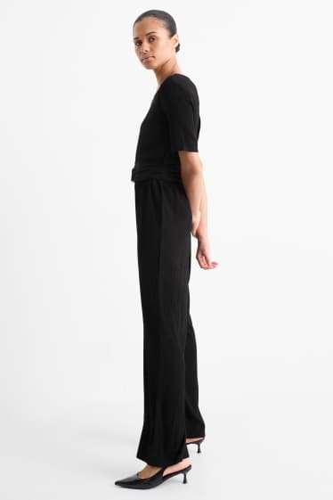 Donna - Tuta con cintura - tessuto tramato - nero