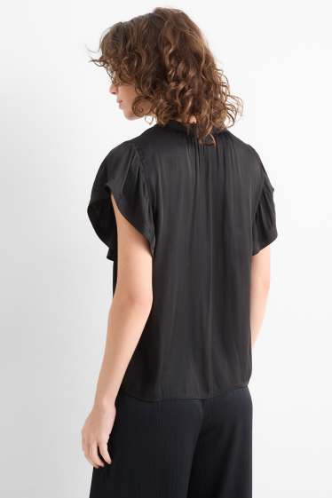 Dona - Brusa amb el coll en punta - negre