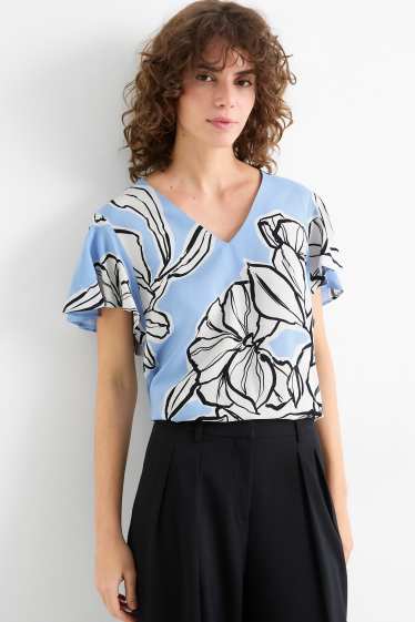 Dona - Brusa amb coll en punta - de flors - blau clar