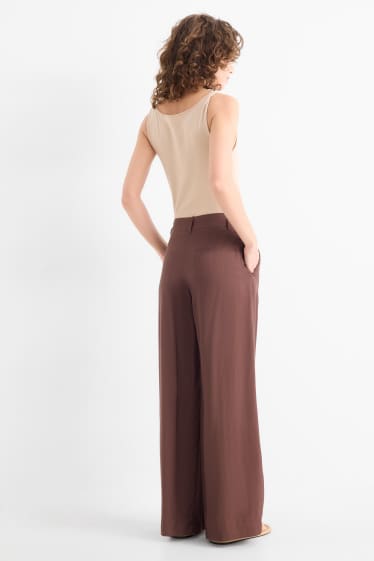 Dona - Pantalons de tela - mid waist - wide leg - marró fosc