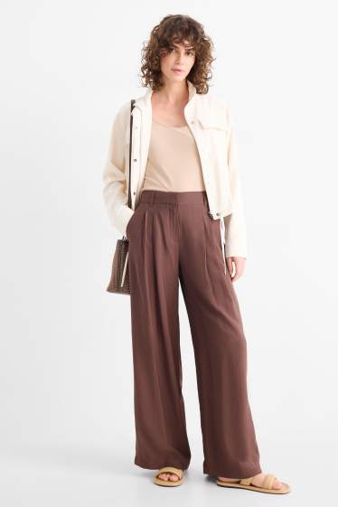 Dona - Pantalons de tela - mid waist - wide leg - marró fosc