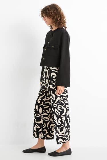 Femmes - Pantalon de jogging - à fleurs - noir / beige