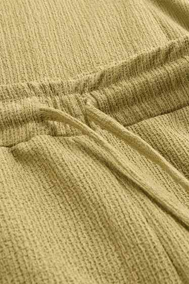 Femei - Pantaloni din jerseu - talie medie - wide leg - structurați - galben