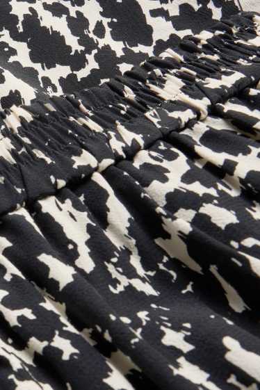 Dames - Korte pantalon - mid waist - wide leg - met patroon - zwart / beige