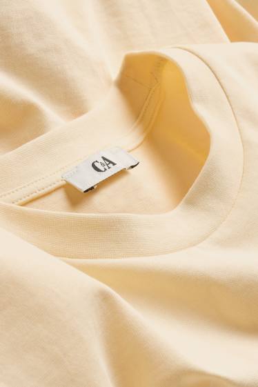 Dames - T-shirt - relaxed fit - lichtgeel