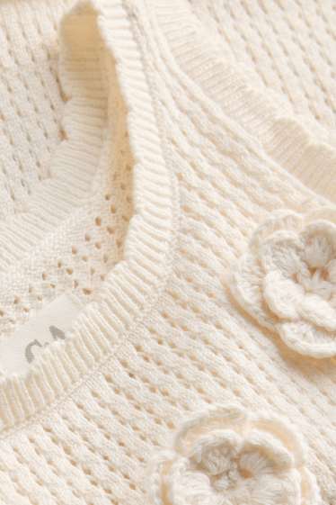 Baby: meisjes - Bloem - gehaakte babytop - crèmekleurig