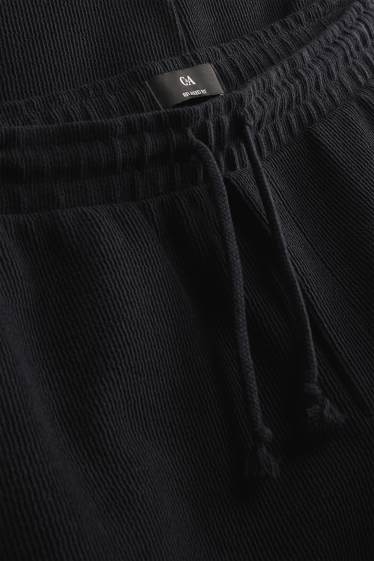 Bărbați - Pantaloni de trening - negru