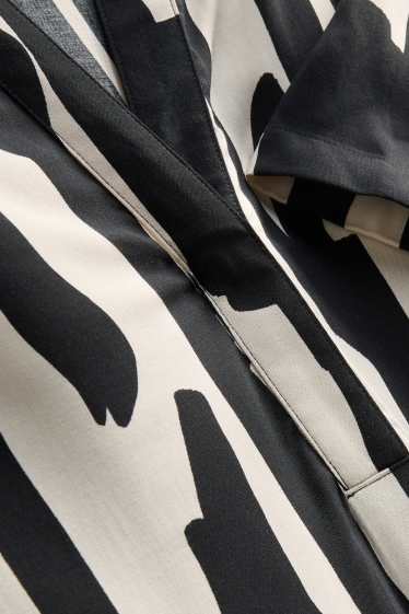 Dames - Viscose jurk met V-hals - met patroon - zwart / wit