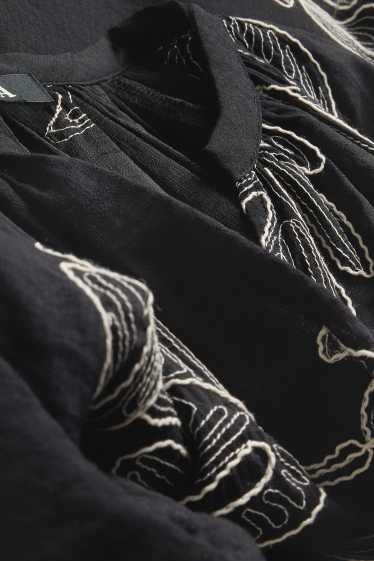 Damen - Bluse mit V-Ausschnitt - gemustert - schwarz