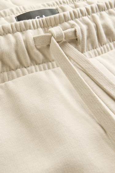 Pánské - Teplákové šortky - béžová