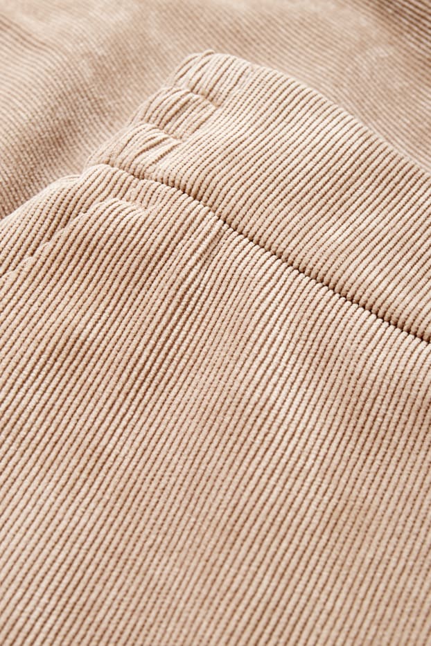 Femei - Pantaloni din catifea reiată - talie medie - wide leg - bej