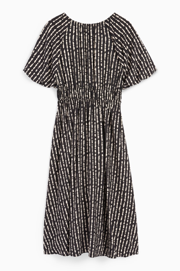 Dona - Vestit de línia A amb escot en punta - estampat - negre
