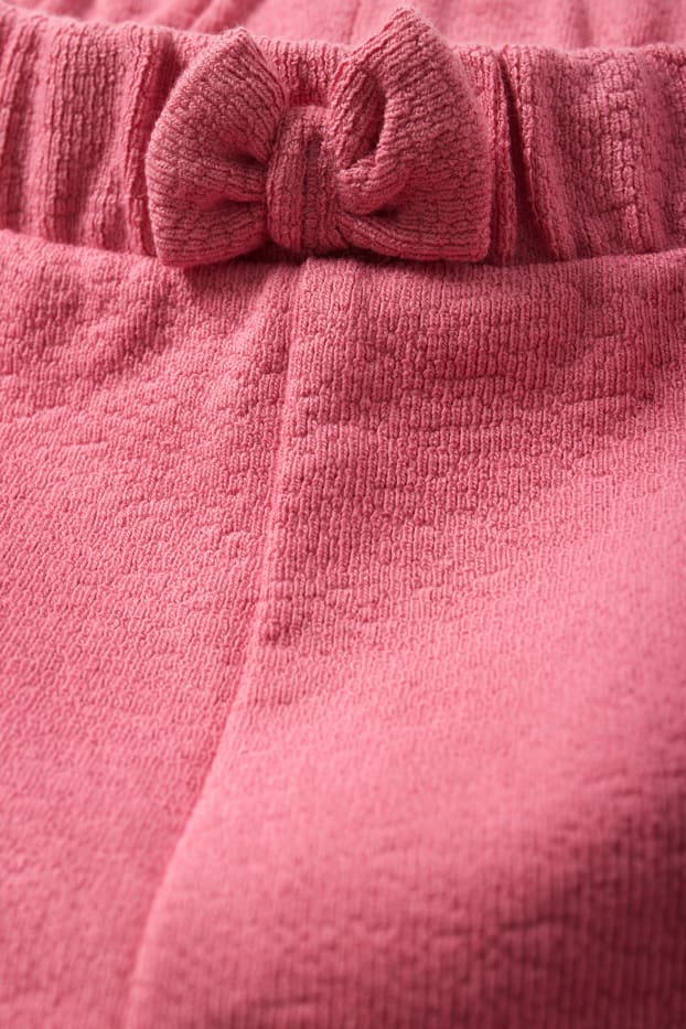 Nadó nena - Pantalons curts per a nadó - rosa fosc
