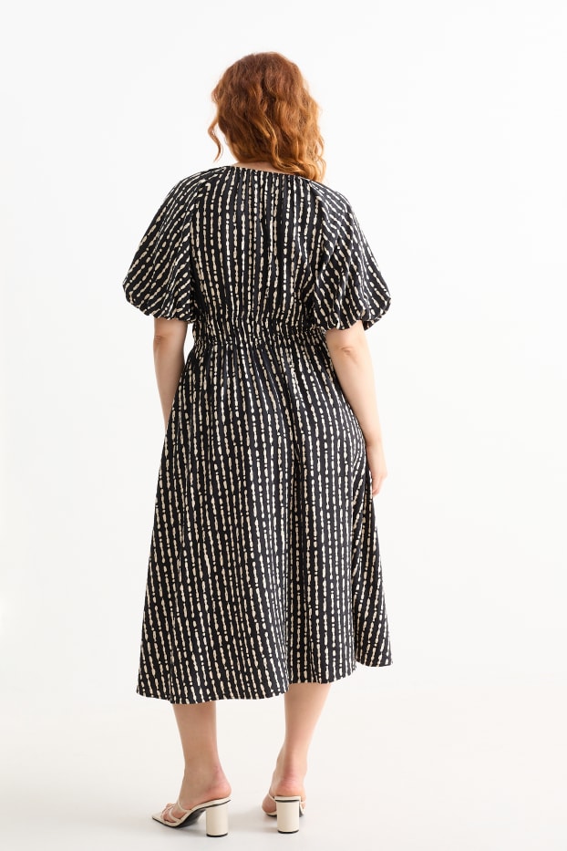 Dona - Vestit de línia A amb escot en punta - estampat - negre