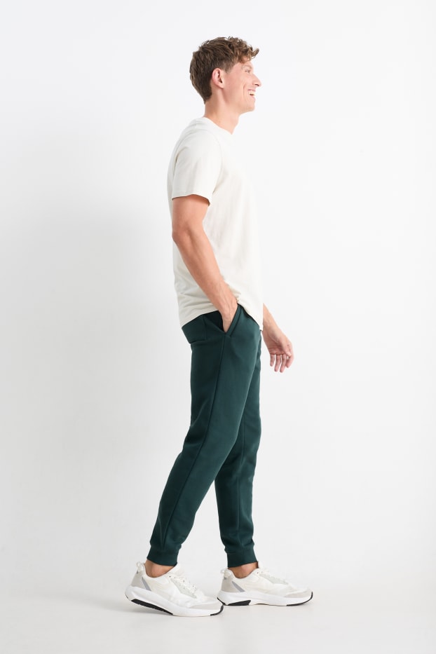 Hommes - Pantalon de jogging - vert foncé
