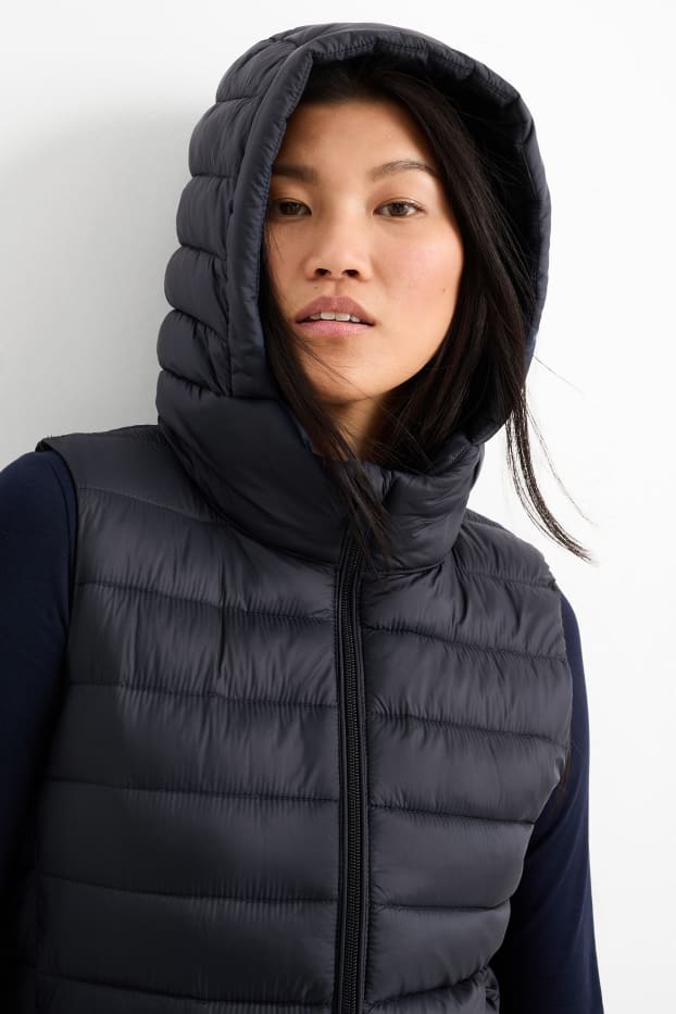 Women - Long quilted gilet with hood - black