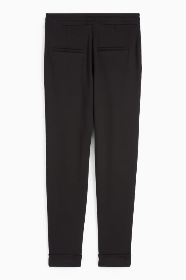 Femei - Pantaloni din jerseu - talie medie - tapered fit - negru