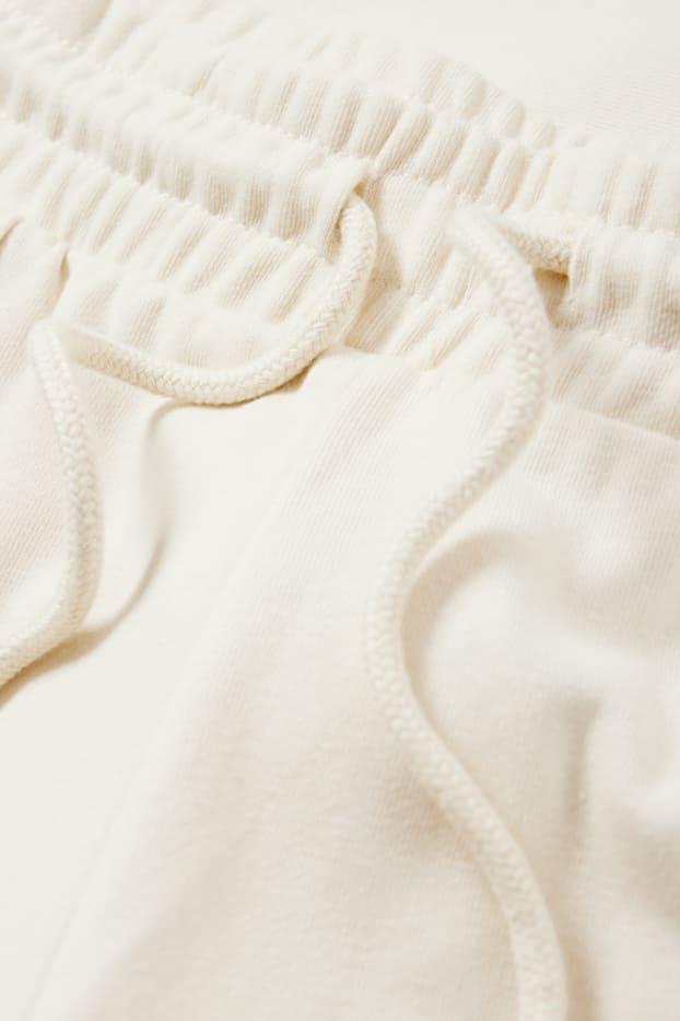 Dámské - Teplákové kalhoty - krémově bílá