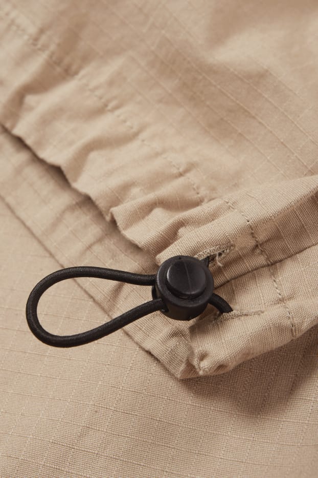 Mężczyźni - Spodnie spadochronowe - beżowy