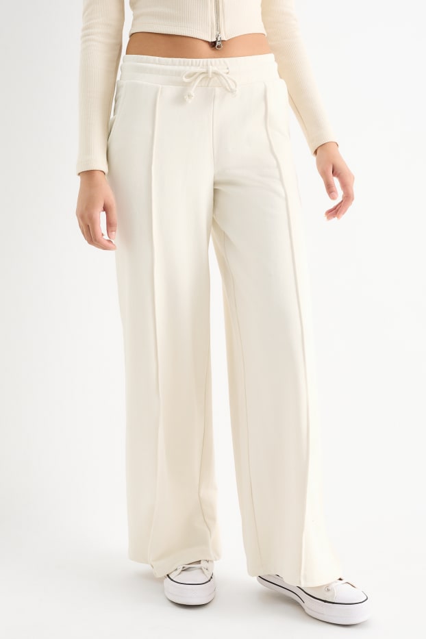 Dámské - Teplákové kalhoty - krémově bílá