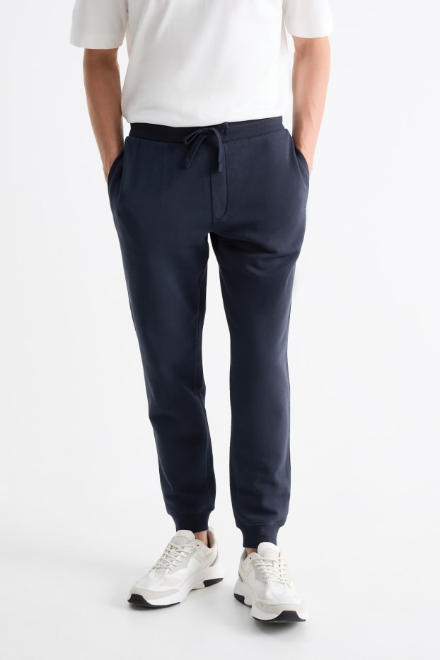 Pánské - Teplákové kalhoty - tmavomodrá