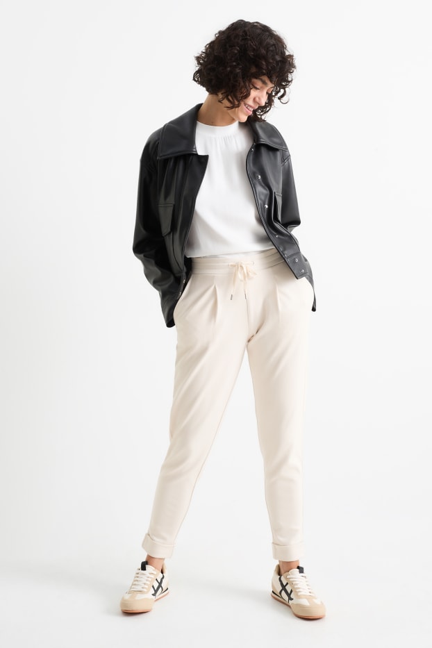 Femmes - Pantalon en jersey - mid waist - tapered fit - crème