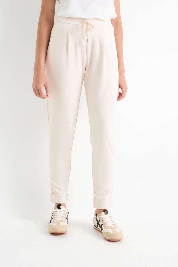 Femmes - Pantalon en jersey - mid waist - tapered fit - crème
