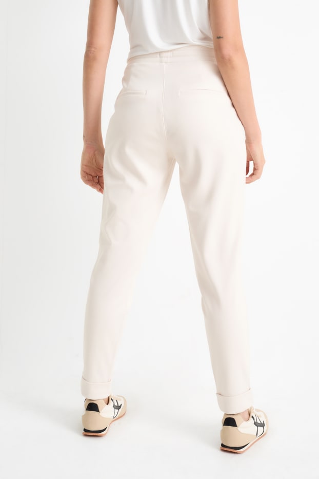 Femmes - Pantalon en jersey - mid waist - tapered fit - crème