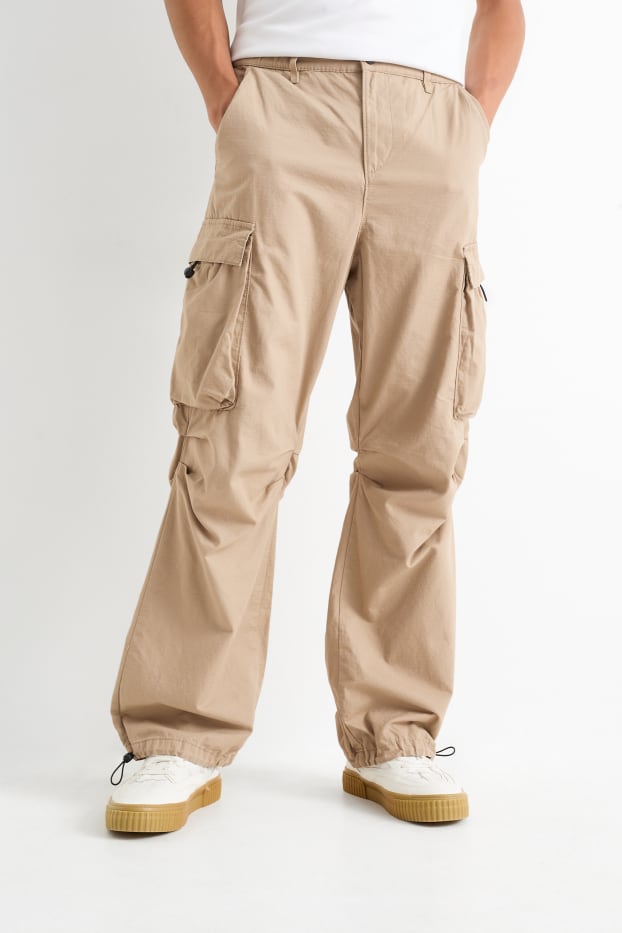 Mężczyźni - Spodnie spadochronowe - beżowy