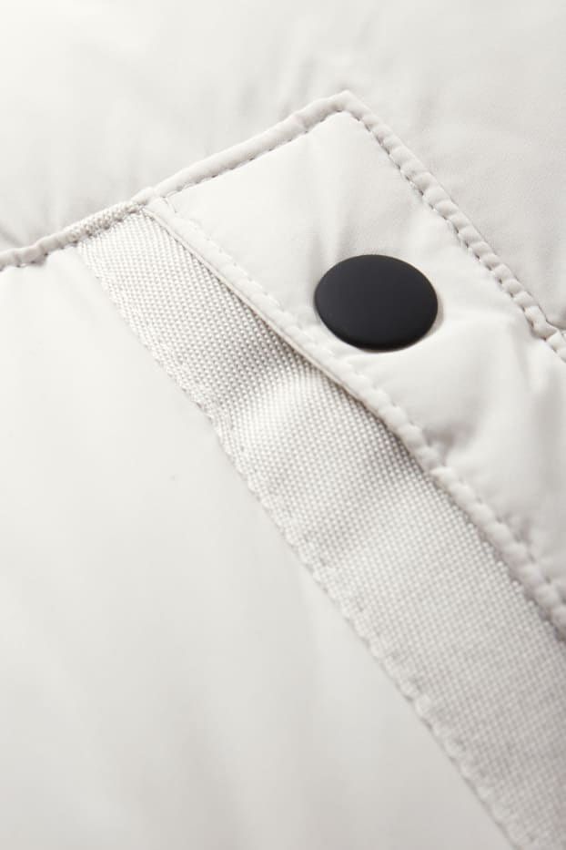 Kinderen: jongens - Bodywarmer met capuchon - waterafstotend - crème wit