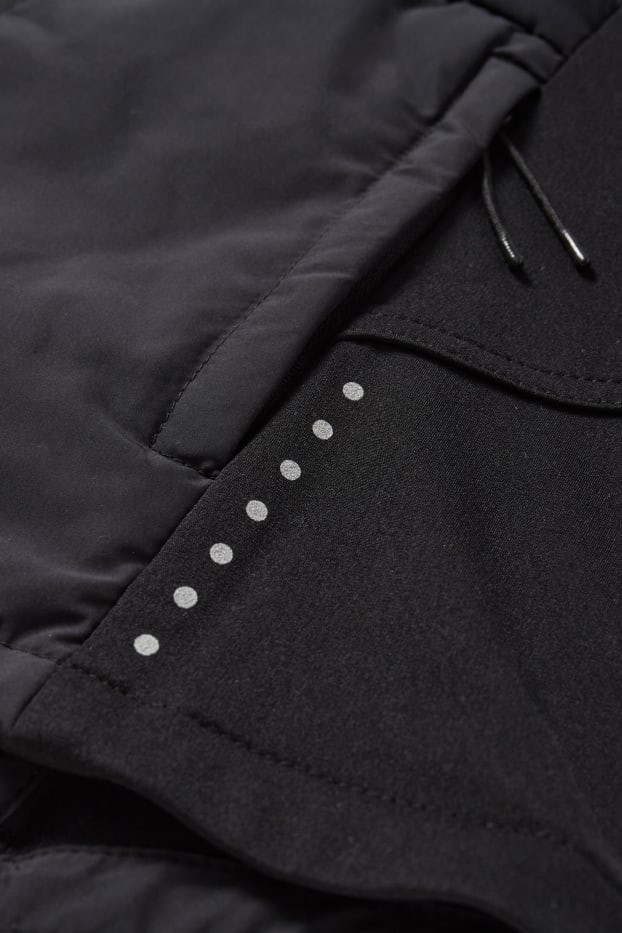 Femmes - Veste chaude de sport à capuche - noir