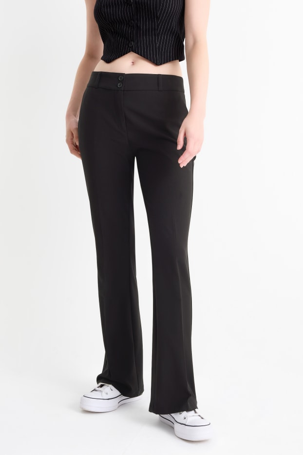 Dona - Pantalons de tela - mid waist - flared fit - negre