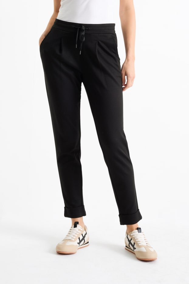 Femei - Pantaloni din jerseu - talie medie - tapered fit - negru