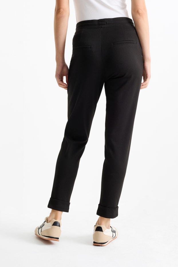 Femei - Pantaloni din jerseu - talie medie - tapered fit - negru