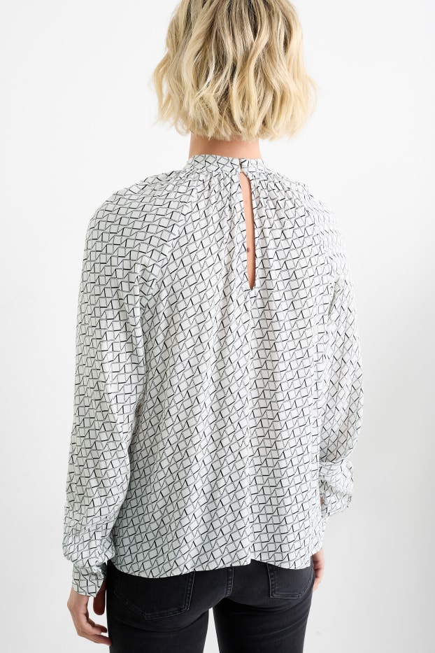 Dona - Brusa formal amb coll alçat - estampada - negre/blanc