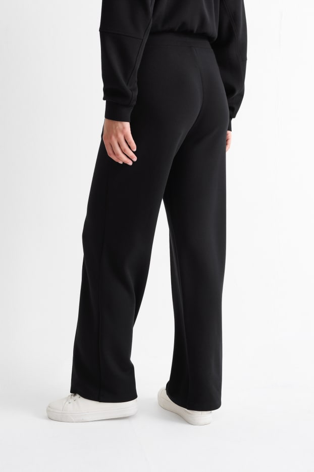 Women - Jersey trousers - high waist - straight fit - black