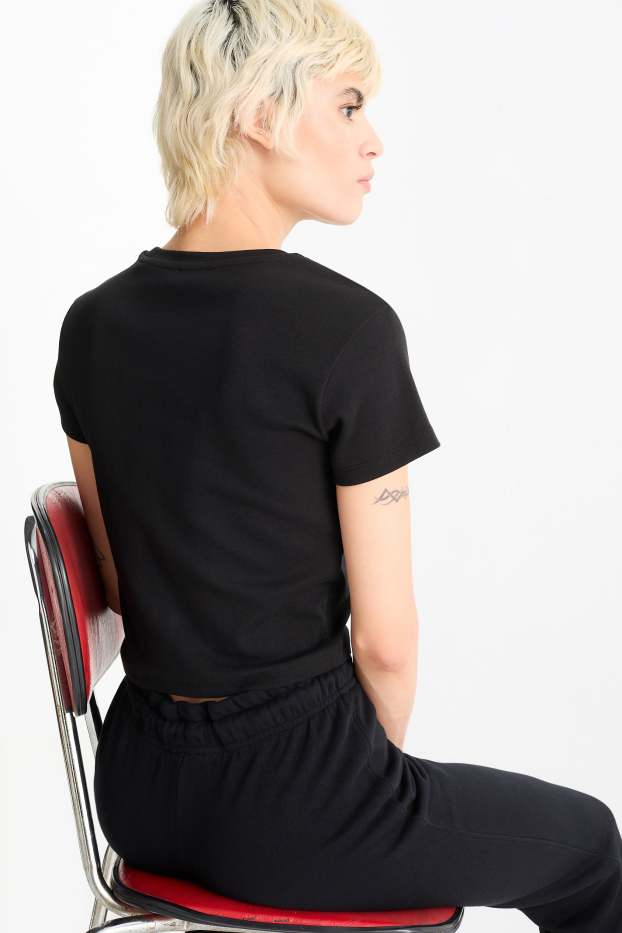 Dona - Samarreta crop de màniga curta - negre