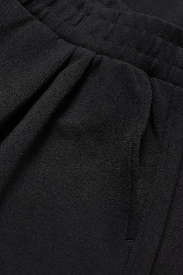 Dona - Pantalons de punt - mid waist - straight fit - negre