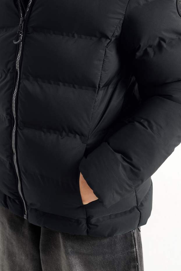 Kinder Mädchen - Steppjacke mit Kapuze - wasserabweisend - schwarz