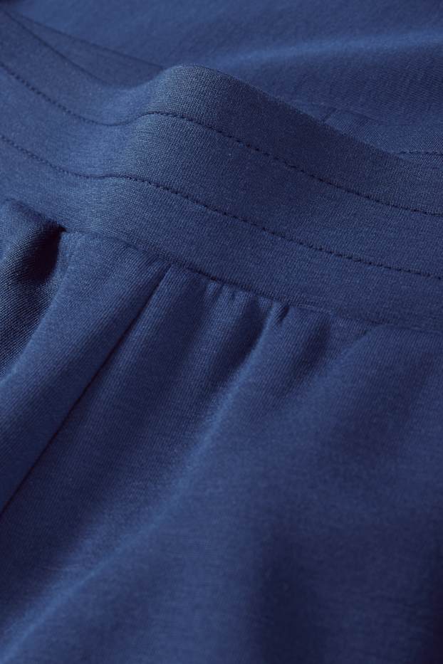 Dona - Pantalons de xandall  - blau fosc
