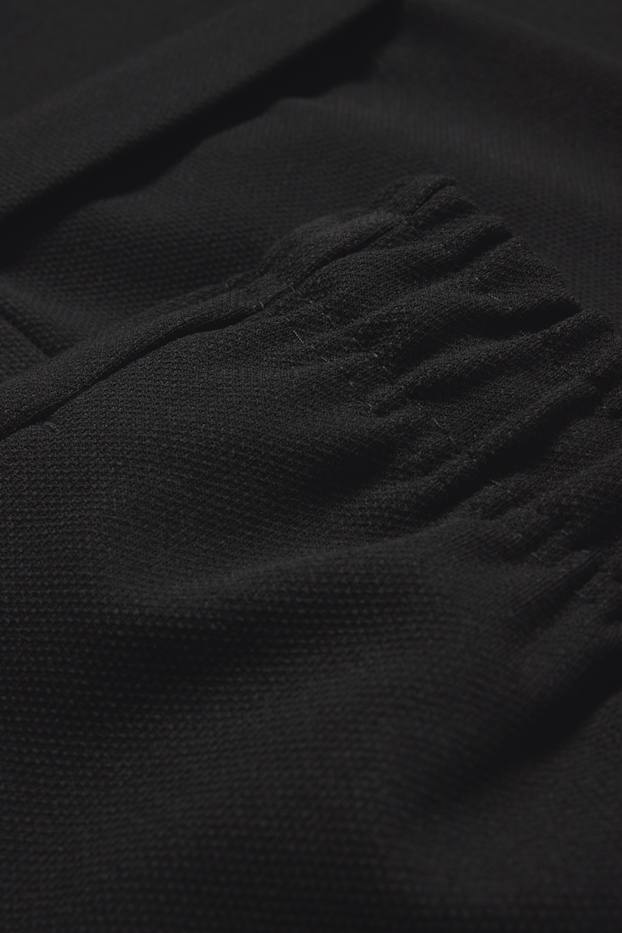 Uomo - Pantaloni sportivi - tessuto tramato - nero
