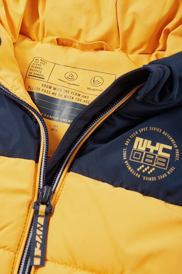 Nen - Armilla embuatada amb caputxa - impermeable - groc