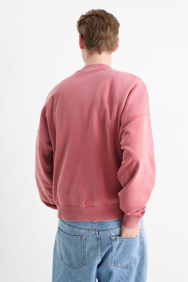 Home - Dessuadora oversized - rosa fosc