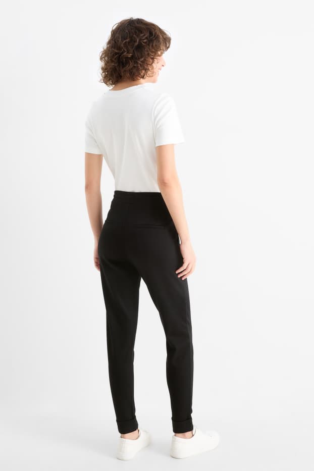Kobiety - Spodnie z dżerseju - średni stan - tapered fit - czarny