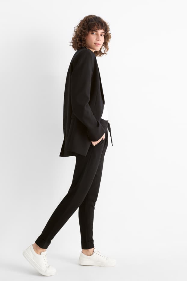 Kobiety - Spodnie z dżerseju - średni stan - tapered fit - czarny